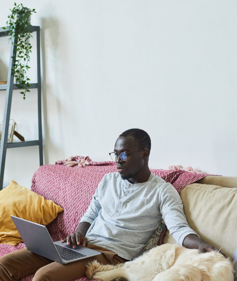 Man with laptop at home